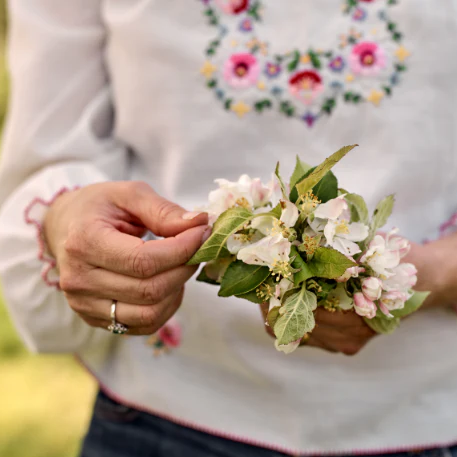 woman holding apple blossom