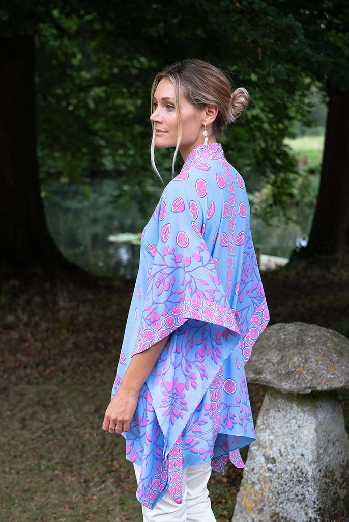A chic addition to your resort wear wardrobe, a poncho can be worn as a cover-up or a shawl-style over formal wear.