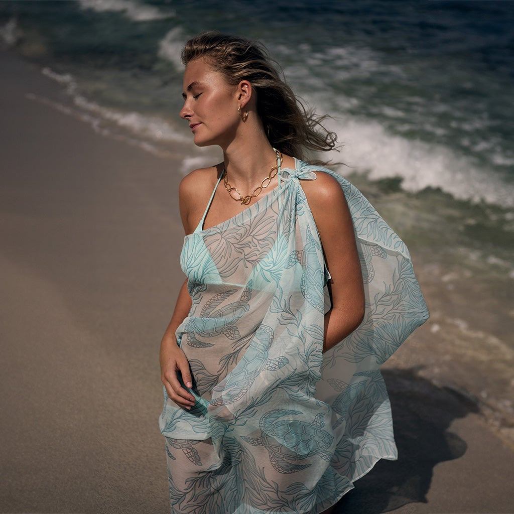 Screen-printed and finished with rolled hems sewn by hand, a feathery soft chiffon silk sarong makes a versatile addition to your holiday wardrobe or an ideal gift.