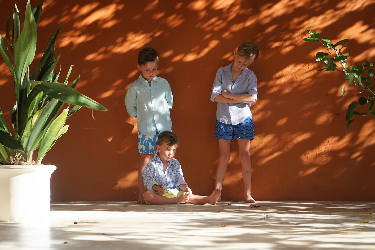 Kids vacation and resort wear collections including unisex linen shirts and boy's swim shorts. Twin with your mini-me with our matching sets in little and large. Ages 4 to 14.