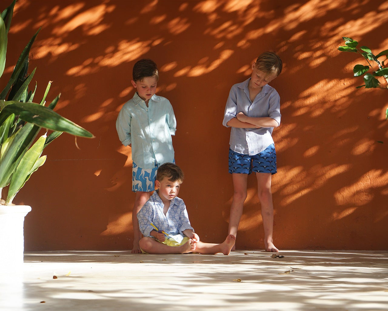 Kids vacation and resort wear collections including unisex linen shirts and boy's swim shorts. Twin with your mini-me with our matching sets in little and large. Ages 4 to 14.