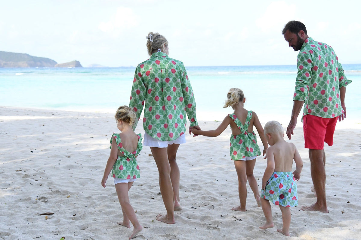 Family wearing Watermelon print linen and swimwear on the beach in Mustique