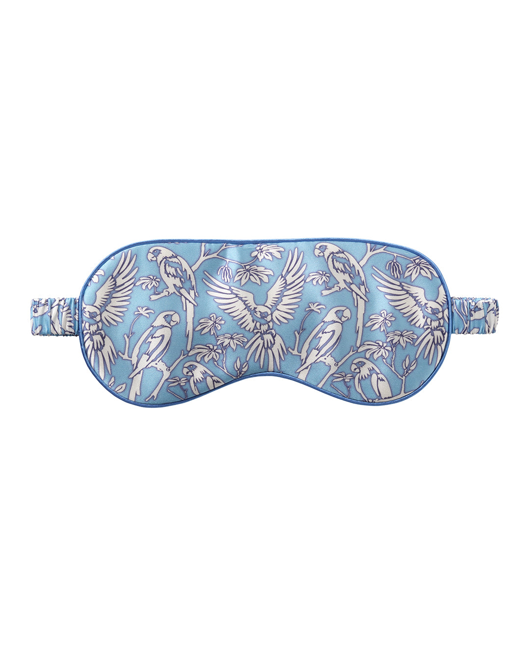Pink House silk eye mask in Parrot Blue print – luxury sleepwear accessory by Lotty B, made from soft silk for restful travel or sleep.