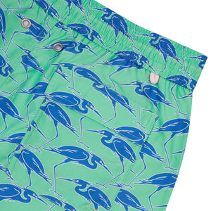 Pocket detail of sustainable Mens swim shorts in green & blue Egret bird print by Lotty B Mustique