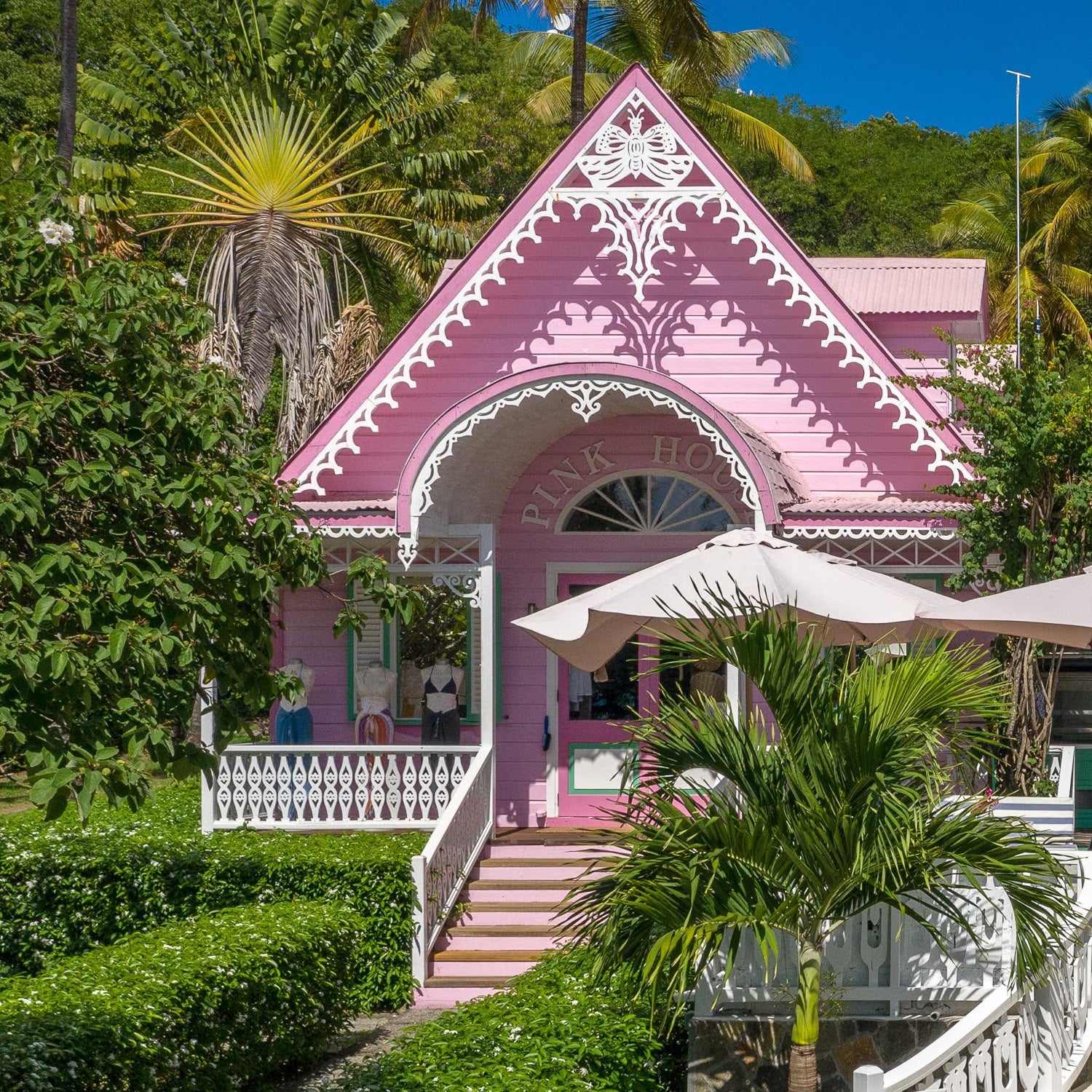 The iconic gingerbread-style boutique shop nestled beneath the palms on the Caribbean island of Mustique.