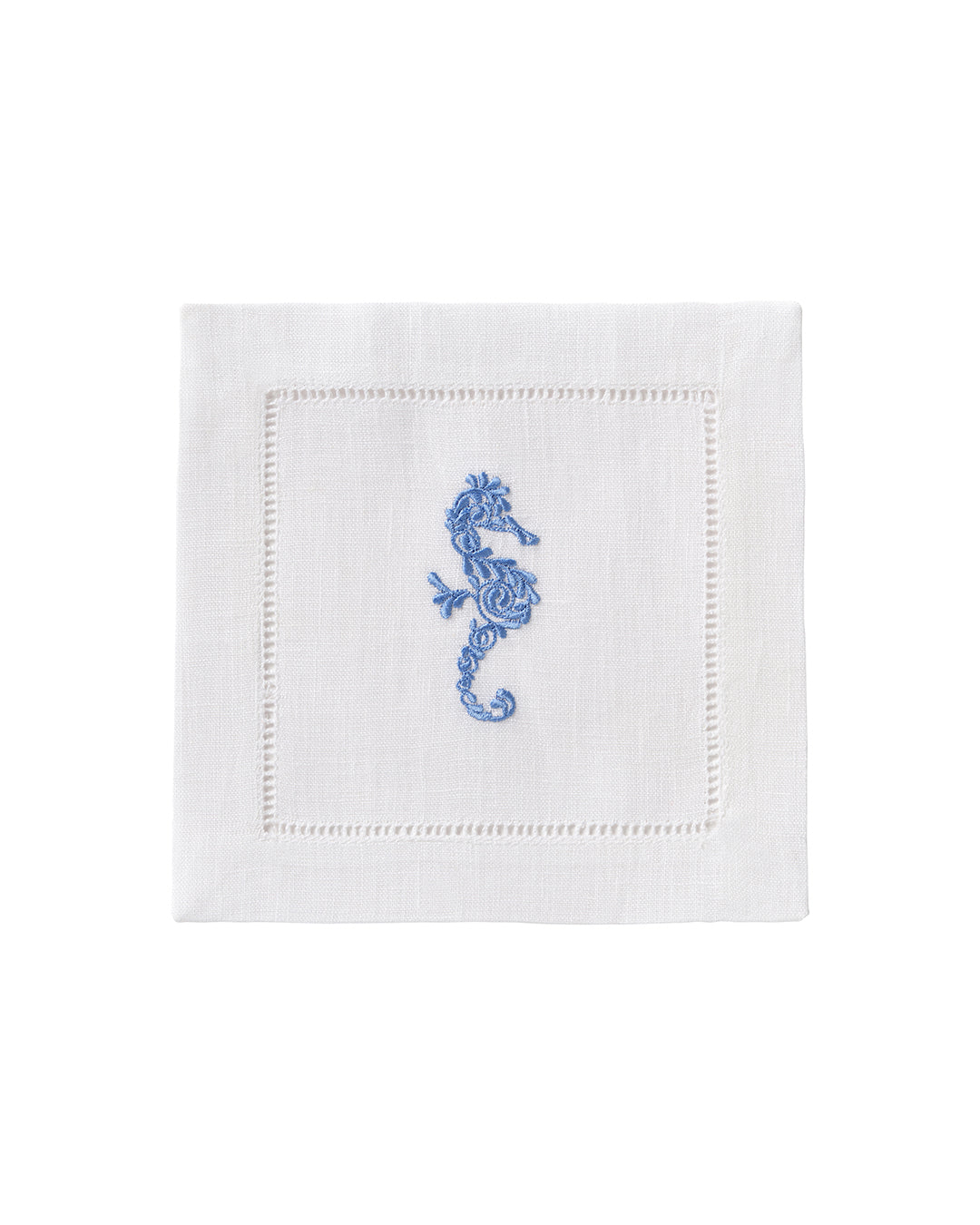 White linen cocktail napkin with blue embroidered seahorse – tropical linen tableware