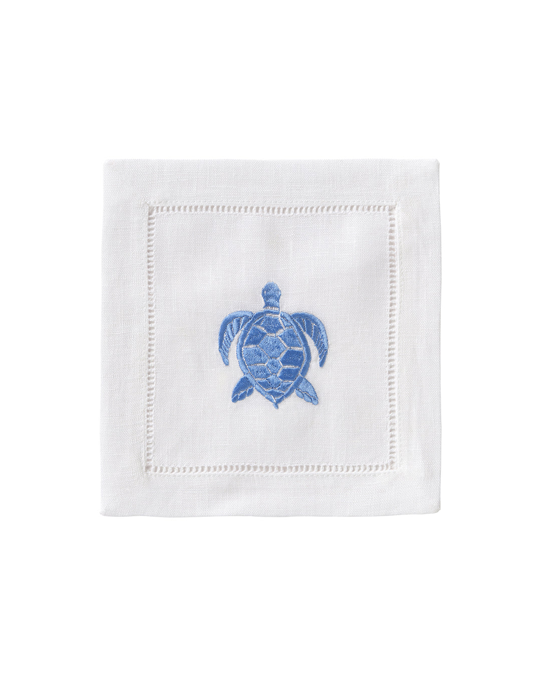 White linen cocktail napkin with blue embroidered turtle – ocean-inspired island table linen