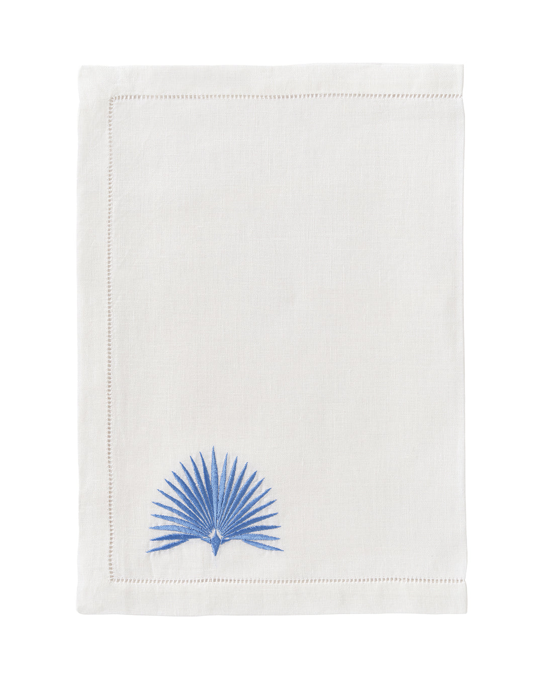 White linen placemat with azure blue fan palm leaf embroidery – luxury coastal table linen by Pink House Mustique