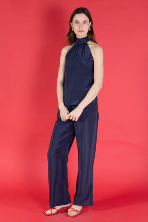 Handmade made to order  pure silk Marina trousers in navy crepe de Chine worn with halterneck Olivia top from Pink House Atelier Collections