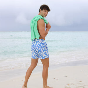 Tropical vacation men's swim shorts in blue Parrot print by designer Lotty B
