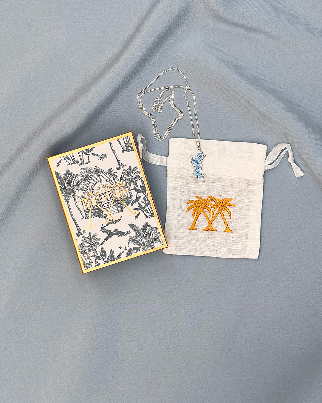 Sterling silver Mustique island pendant necklace with blue zirconia crystals and gift box Made in England