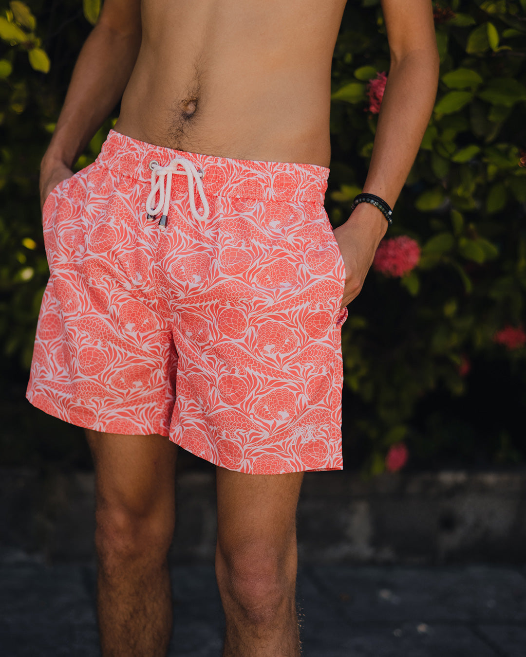 man in designer swim shorts