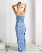 Back view of silk crepe de Chine bandeau top in Parrot Blue print with halterneck tie worn with matching sarong