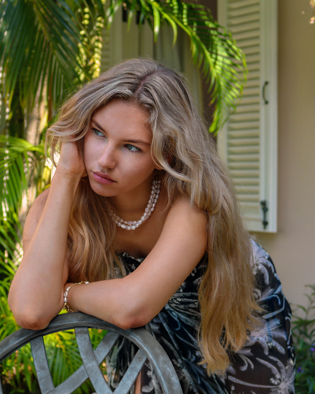 Style a pure chiffon silk sarong in black and white Plantation pattern as a skirt and worn with matching silk bandeau top by designer Lotty B Mustique Island