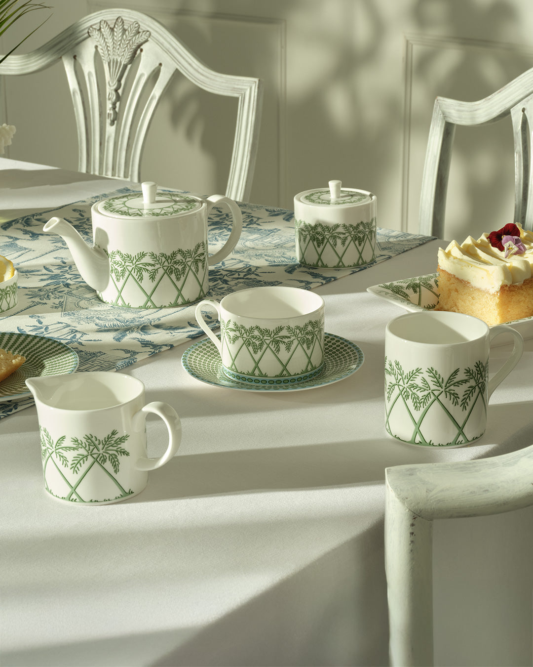 Fine bone china teapot, milk jug, sugar pot and cup & saucer in Palms Sage Green by Lotty B Mustique, elegant English tea set.