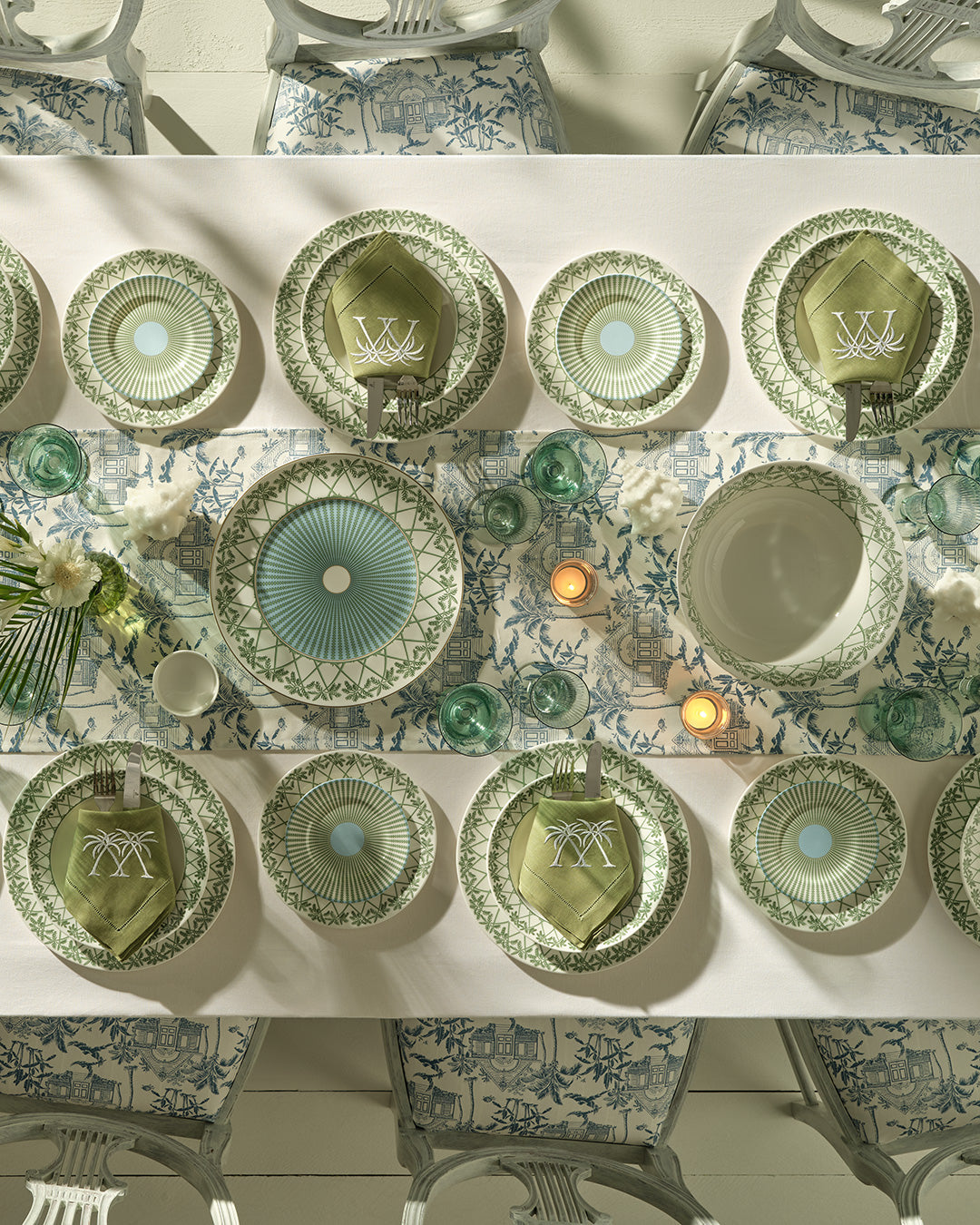Elegant fine bone china dinner service including dinner plates, rimmed bowls, salad plates, side plates and charger plates in Palms Sage Green design, handmade for Pink House Mustique.