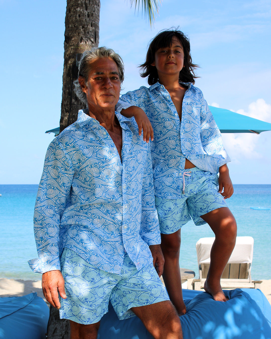 father and child in matching vacation outfits
