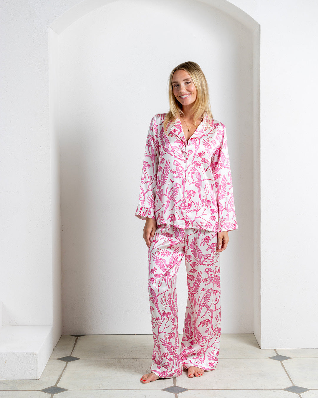 Elegant silk pyjama set for women in tropical Parrot Pink print – full-length pants and button-up top