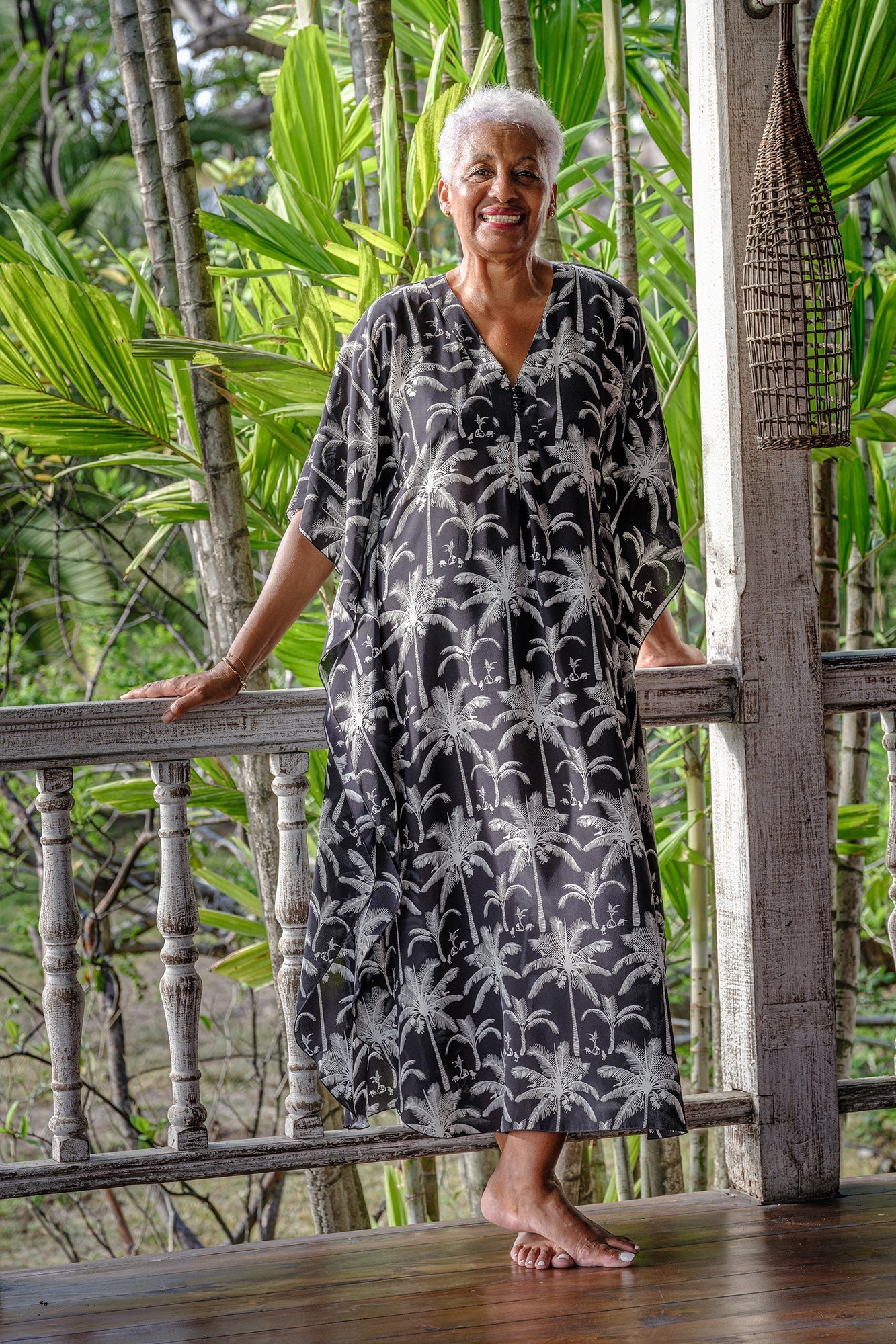 Silk Jenlee kaftan Plantation Dusk long luxury resortwear beach cover up worn in tropical garden setting