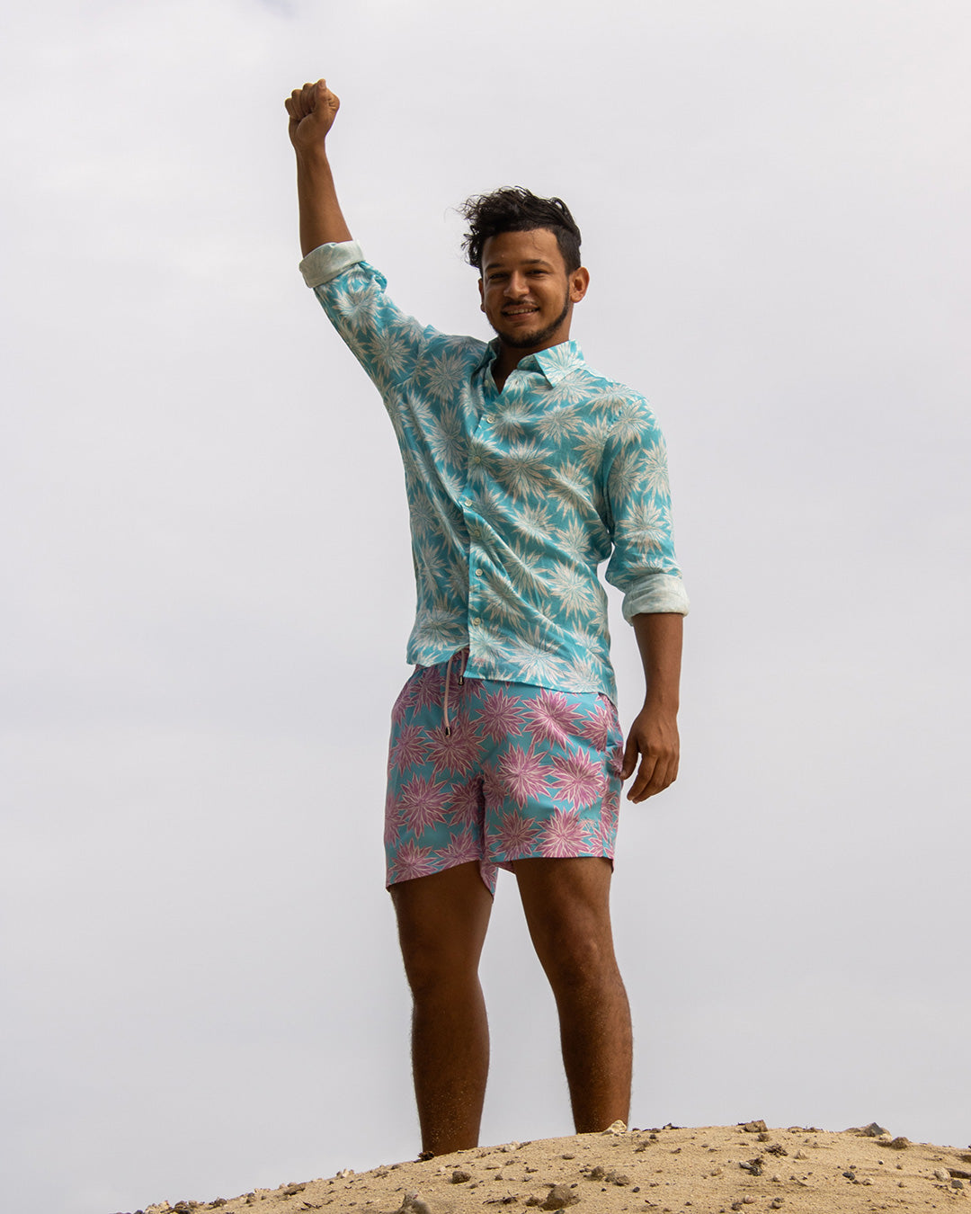 Men’s Agave turquoise linen shirt and turquoise pink swim trunks, relaxed island style by Pink House Mustique Resort 2026.
