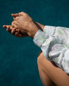 Tropical island villa women's linen shirt cover up in pale blue and green Monkey and Palm print by designer Lotty B