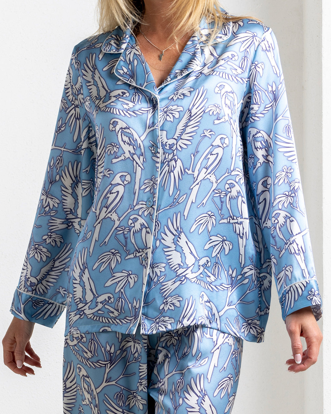 Close-up of silk pajama top in Parrot Blue print – luxury women's sleepwear in pure silk by Lotty B Mustique