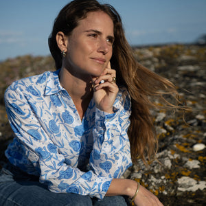 female with hand on chin and shirt on
