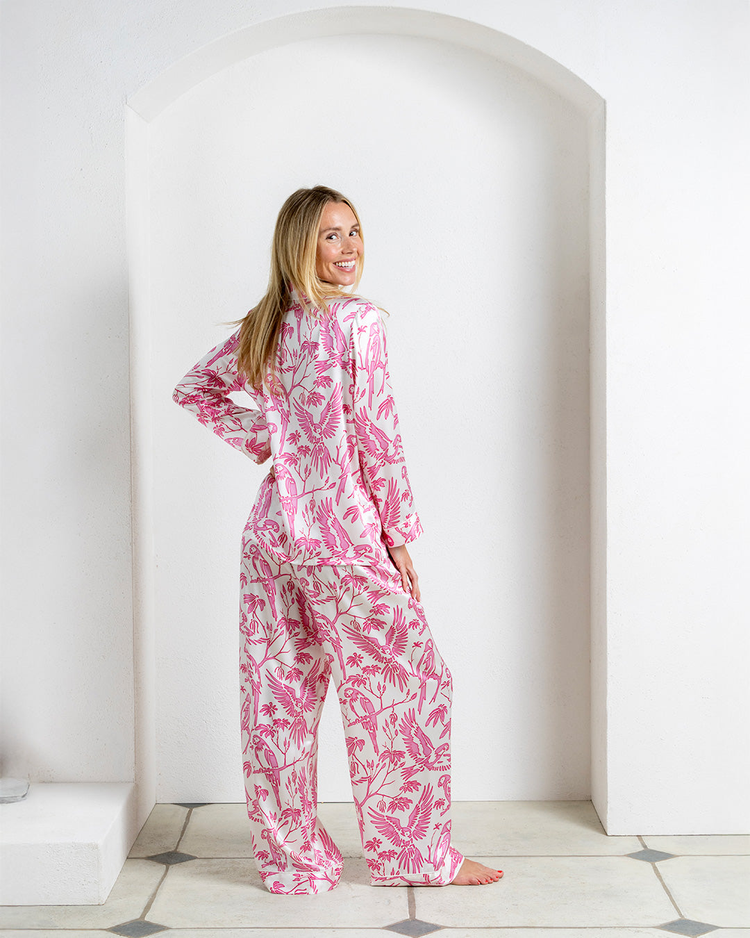 Designer silk pyjamas in Parrot Pink bird print – women's long sleeve set for sleep or resort lounging