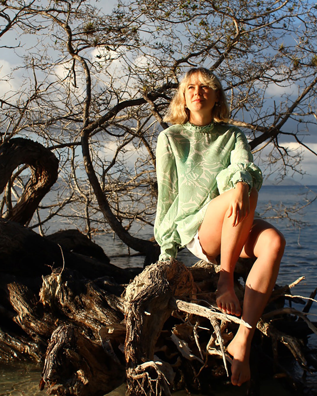 Chic on Mustique beach pure silk Kelly blouse in Protea sage green and white by designer Lotty B for Pink House