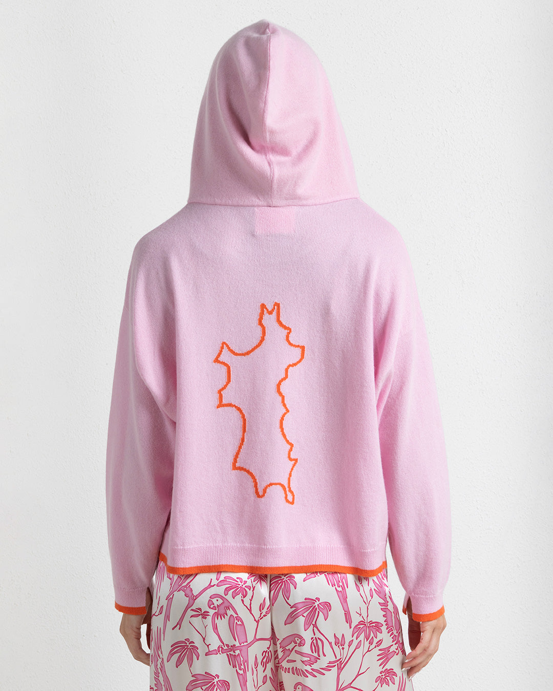 Darlin London x Pink House Mustique cashmere hoodie pink with orange trim Mustique Island back motif