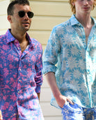 Men wearing Iguana Blue & Pink linen shirt and Agave Turquoise linen shirt, relaxed island resort style on Mustique.