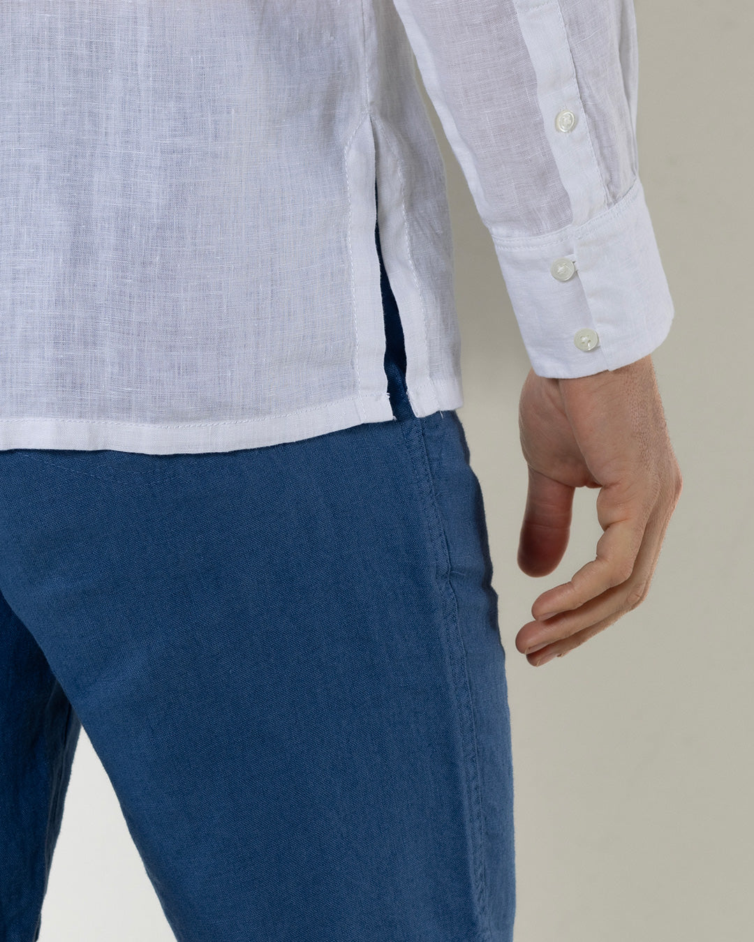 Mens white linen shirt side split hem detail with grandad Nehru collar, lightweight resort wear styling