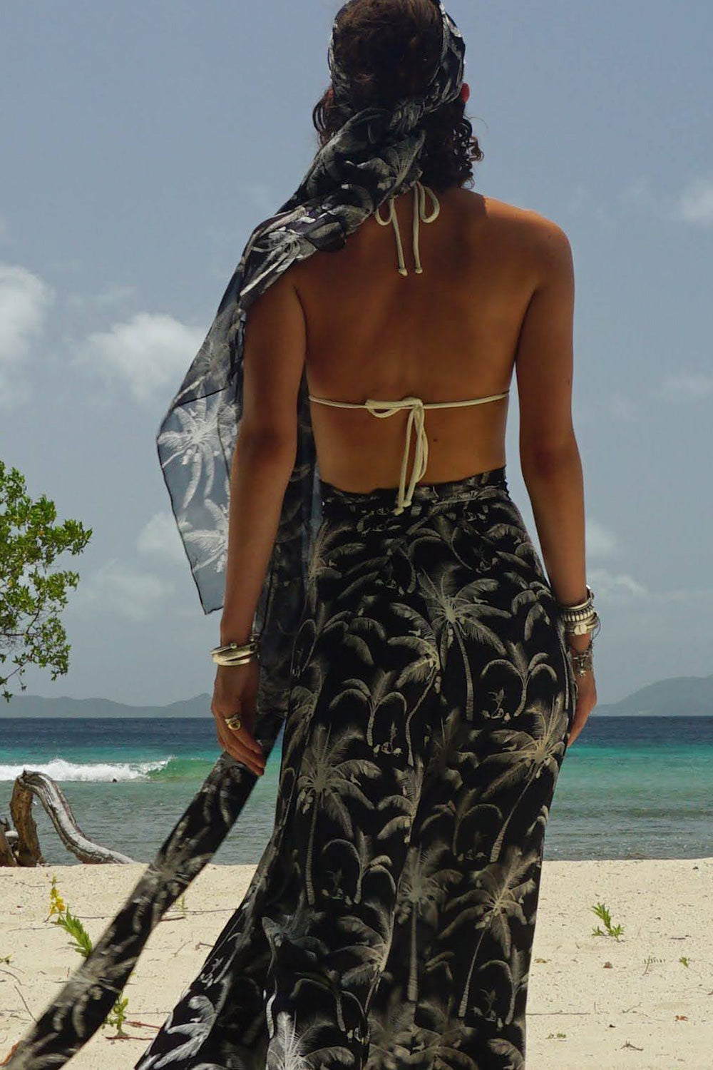 Style a pure chiffon silk sarong in black and white Plantation print as a head scarf and pair with matching silk palazzo pants by designer Lotty B Lagoon Bay, Mustique Island