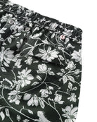 Close-up back pocket detail of Iguana print swim shorts in spruce green | Eco resort swimwear | Pink House Mustique