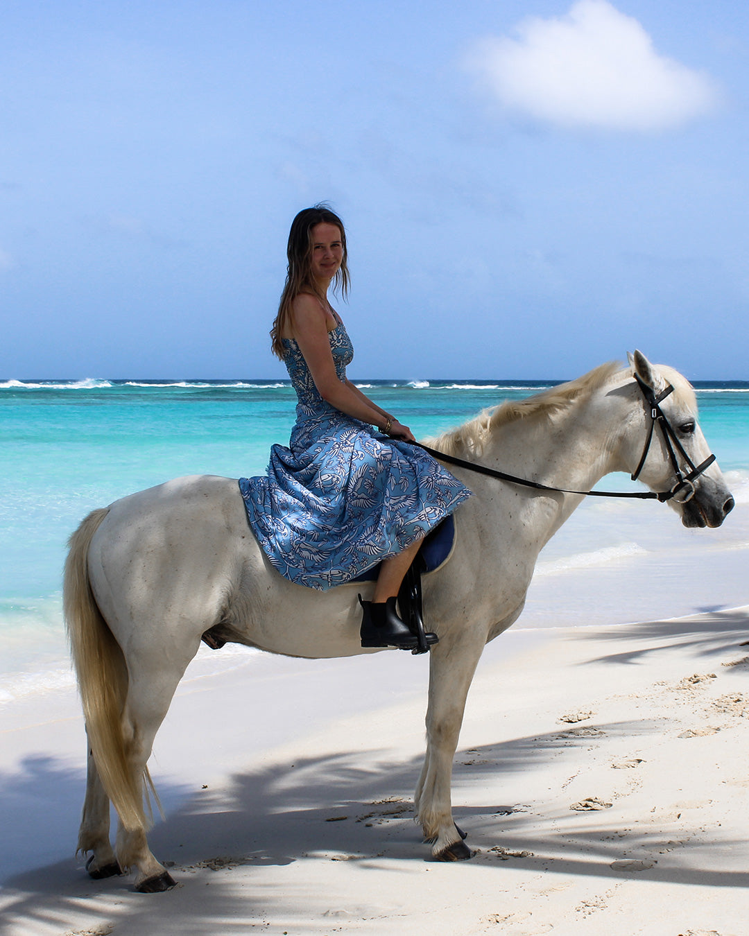 Parrot Blue silk sarong and ruched bandeau set on horseback at Lagoon Bay, Mustique – elegant beach style
