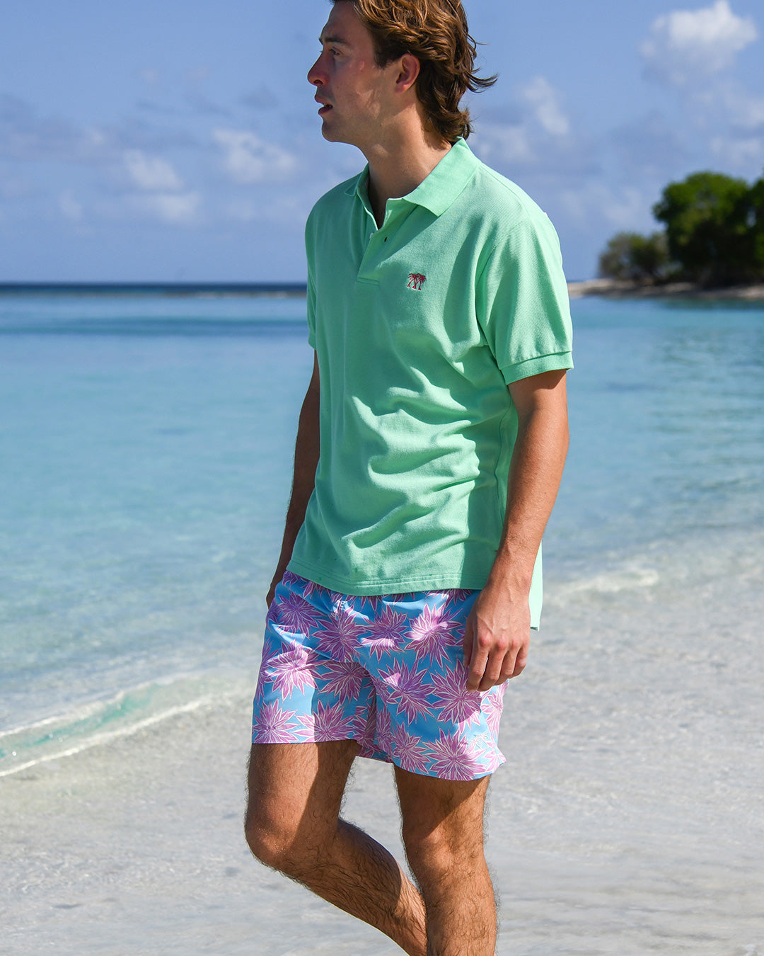 Men’s Agave turquoise pink recycled swim trunks with green cotton polo, Lagoon Beach Mustique.