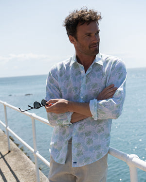 Holiday style mens linen shirt in Monkey & Palm pale blue & green print by designer Lotty B