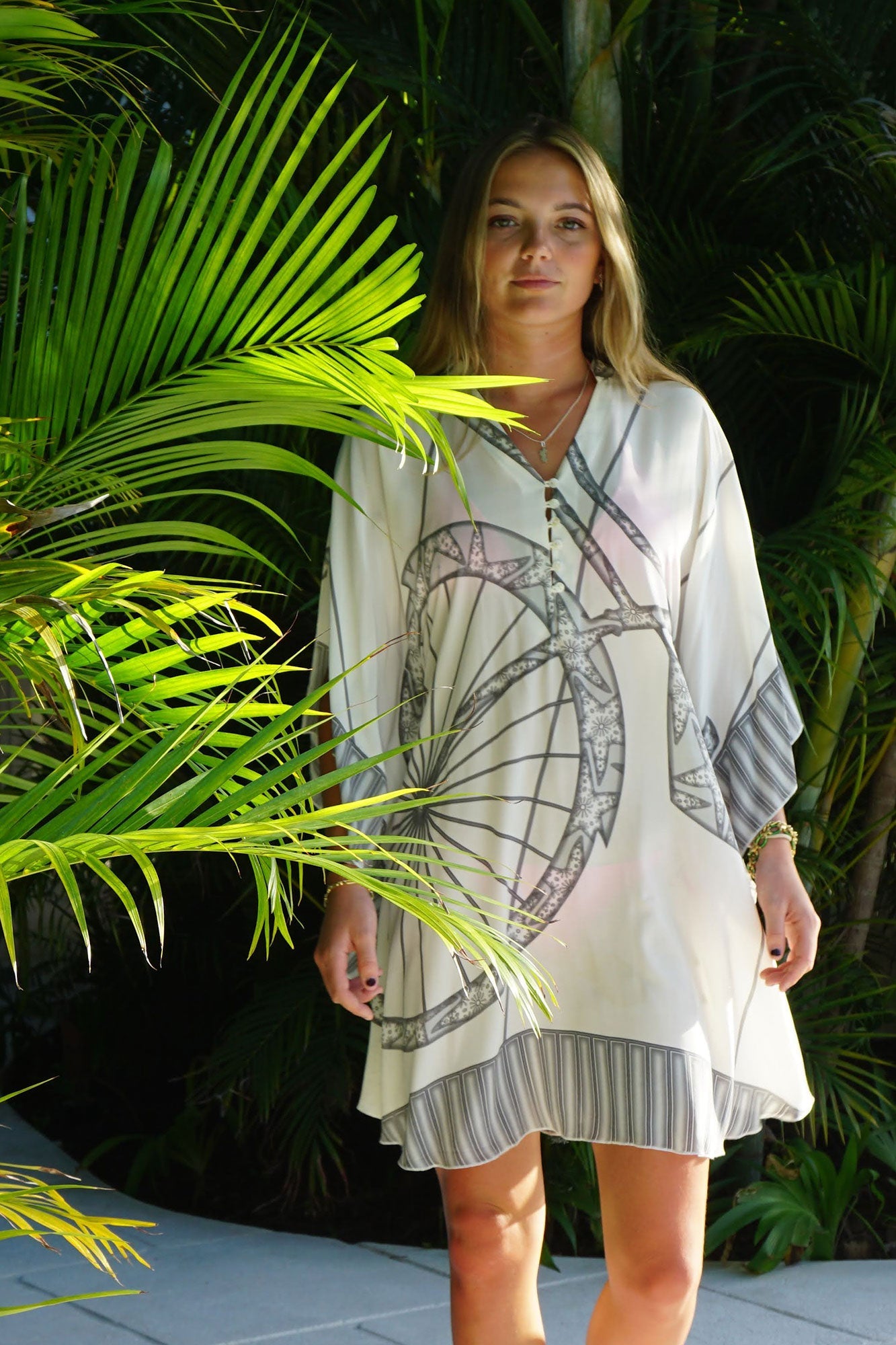 Luxury island vacation style in a bicycle print pure silk kaftan in by designer Lotty B Mustique