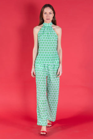 Handmade made to order Marina trousers in lime slice print silk crepe de Chine worn together with matching Olivia halterneck top from Pink House Atelier Collections