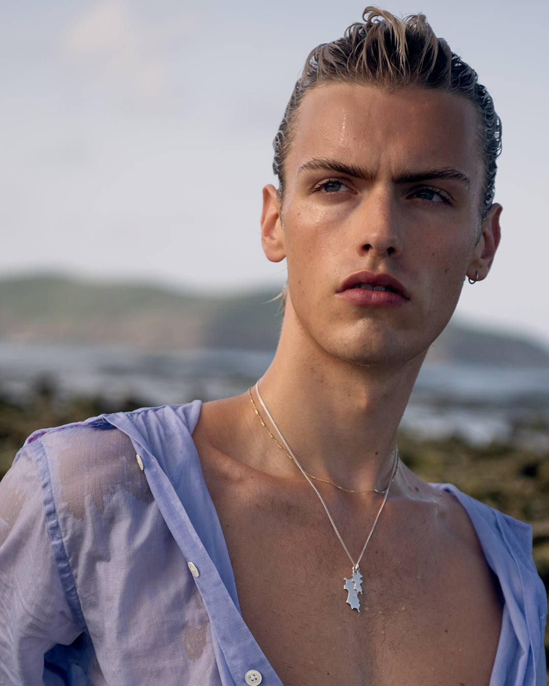 Stacked sterling silver Mustique island pendant necklaces worn at the beach hallmarked jewellery Made in England