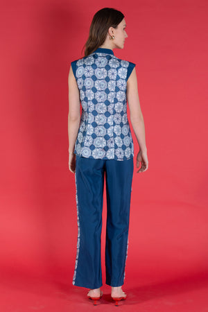 Elegant Marina trousers in blue silk crepe de Chine with an April Showers print stripe worn together with matching Marina waistcoat top from Pink House Atelier Collections
