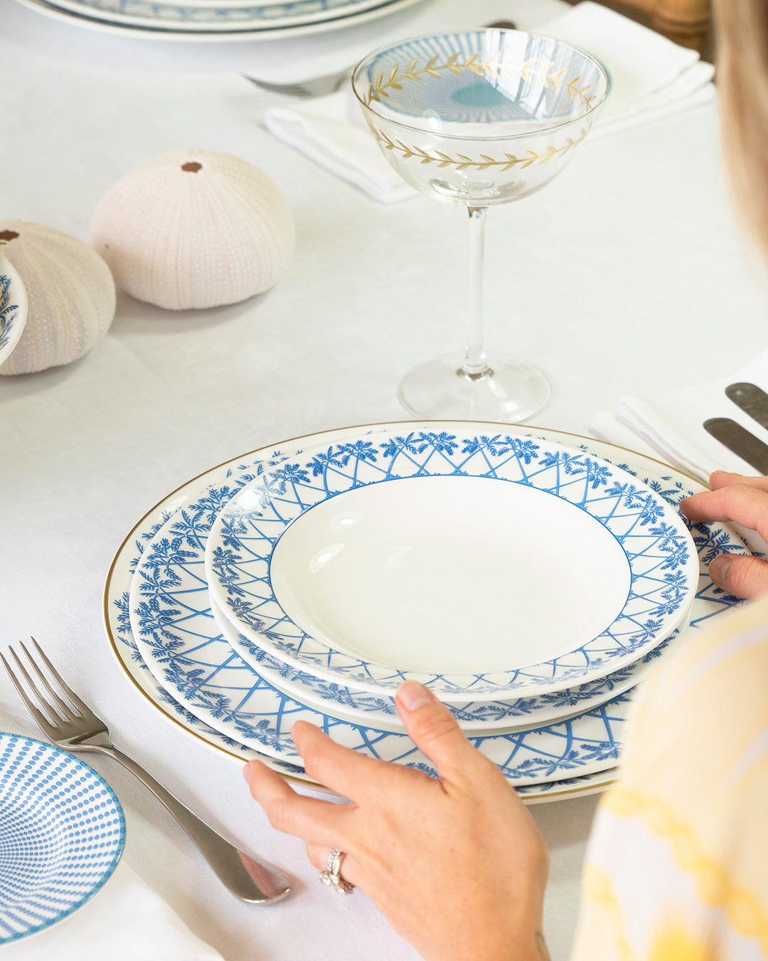Summer lunch table with fine bone china Palms Azure Blue rimmed bowl and Coconut Blue design details.