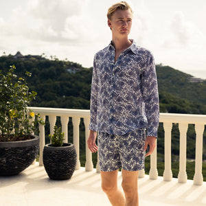 Sustainable vacation wear mens swim shorts in navy blue floral Protea print
