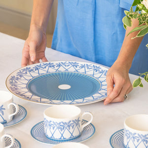Setting the table with fine bone china decorative charger plate in Palms blue design by Lotty B
