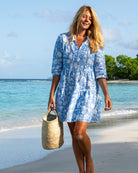 Women’s blue Iguana print linen Amy dress by Pink House Mustique, relaxed island style on the beach.