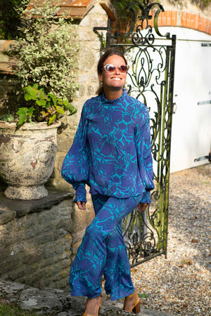 Luxury fashion fit & flare silk trouser suit in Protea violet & turquoise print by designer Lotty B