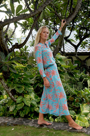 Designer resort outfit, palazzo pants in tropical turquoise & orange plantation palm print with matching silk Kim blouse