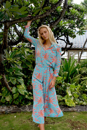 Chic holiday outfit, palazzo pants in tropical turquoise & orange plantation palm print with matching silk Kim blouse