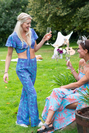Summer style fit & flare silk trousers in Protea violet & turquoise print by designer Lotty B