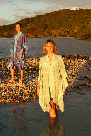 Beach vacation style buttoned poncho in floral green Protea print by Lotty B Mustique